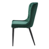 Winged back upholstered chair in green velvet