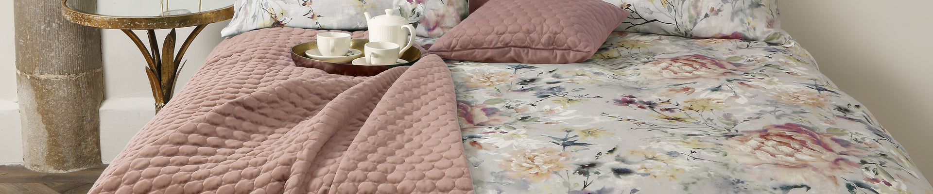 A stylish Scatter Box Halo Blush throws and cushions in various colors and designs, perfect for adding elegance to any room.