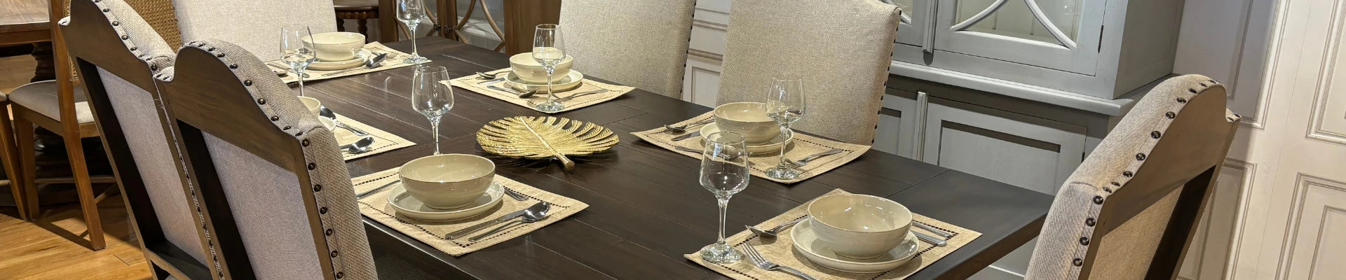 A stylish dining area featuring a modern dining table, elegant dining chairs, and a sophisticated setup.