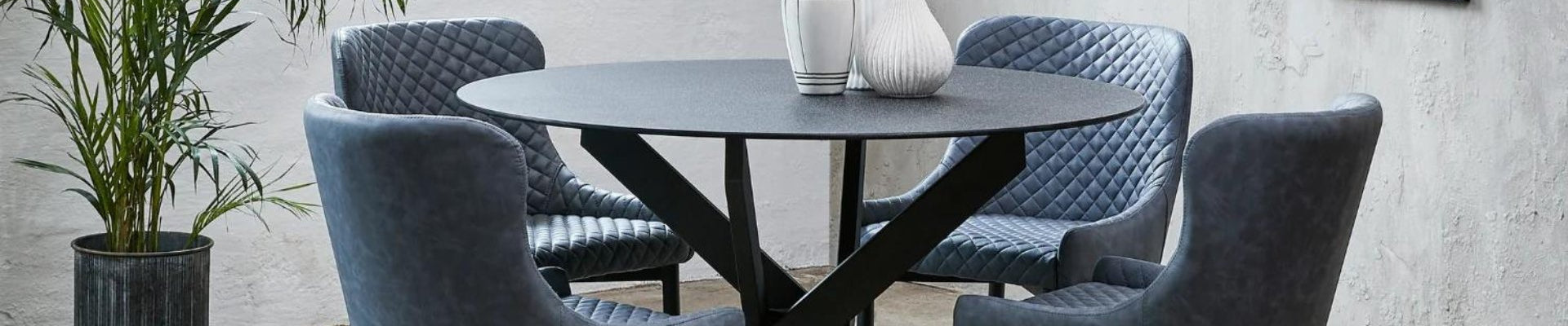 A set of elegant dining chairs surrounding a beautifully set dining table, showcasing a blend of modern and classic dining room furniture styles.