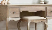 A stylish dressing table in a beautifully arranged bedroom.