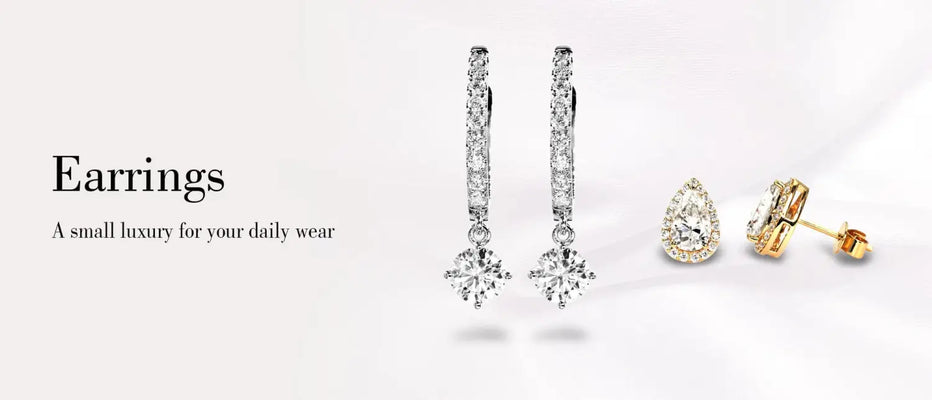Silver and gold earrings including studs, hoops, and gemstone designs from Foy and Company