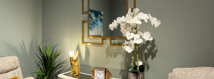 A stunning gold mirror from Foy and Company's Gold Mirrors collection, adding elegance and light to a modern living space.