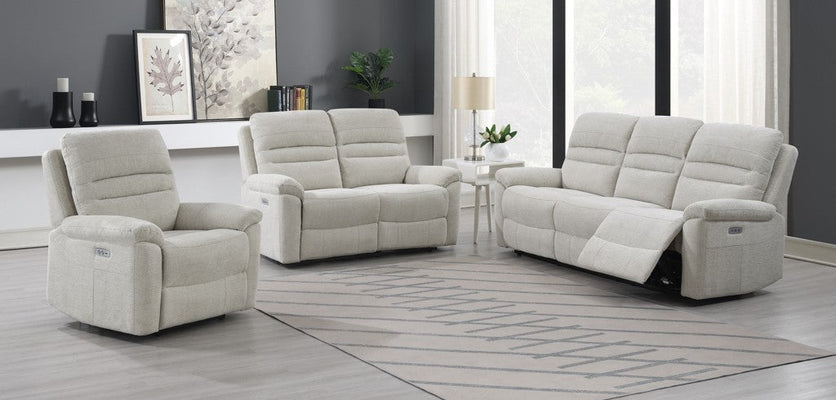 Living room with a modern three-piece sofa set featuring soft cushions and matching decor.