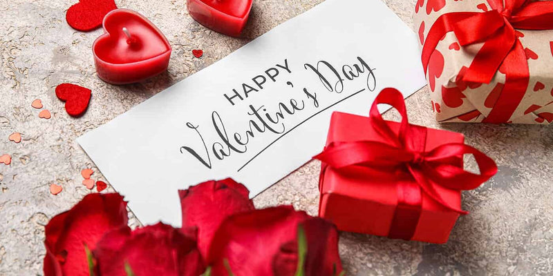 A beautifully wrapped Valentine's Day gift box with jewelry and romantic décor, perfect for him and her.