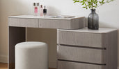 Elegant vanity table with storage drawers and padded stool