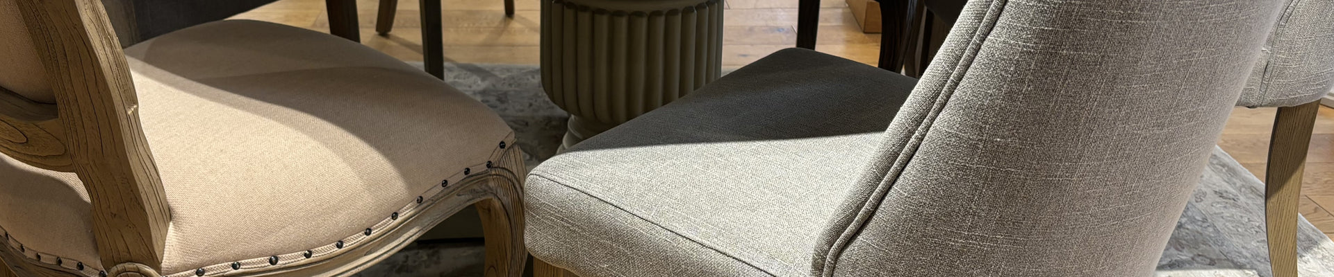 Assortment of fabric dining chairs in various colors, adding charm to any dining room