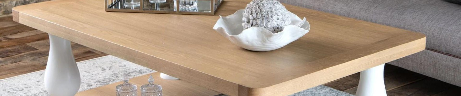 A modern living room featuring a stylish coffee table, complemented by a comfortable sofa and chic living room furniture.