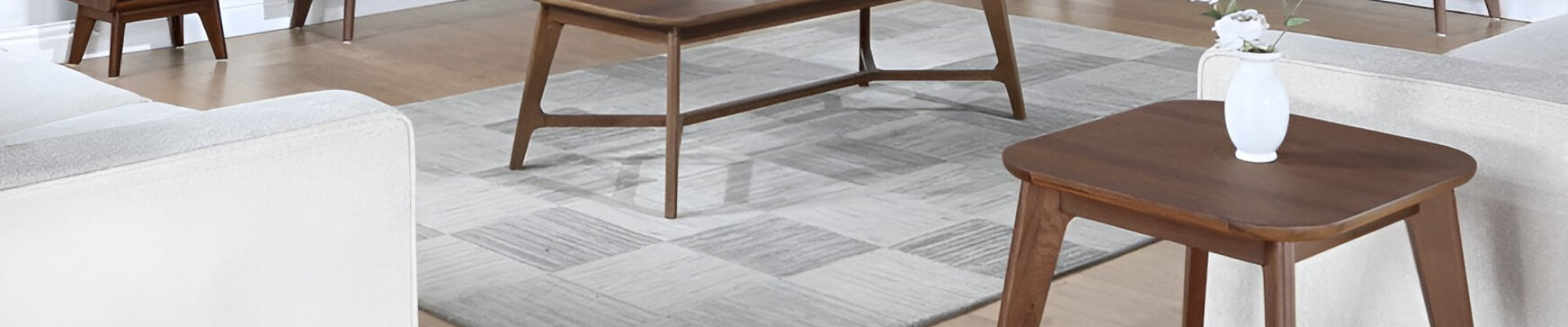 A beautifully decorated living room featuring an elegant lamp table with a stylish lamp, surrounded by cozy furniture and accent pieces.