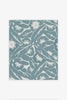 Elegant floral wallpaper in blue with layered design and chalky matt finish