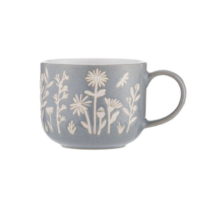 Sip your favorite brew in style with 'The Meadow Blue Daisy Mug,' a charming ceramic mug adorned with delicate blue daisies.