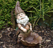 Polyresin garden statue gnome holding a leaf for decorative storage.