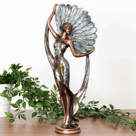 Adorn your space with the elegance of the Silhouette Lady Figurine in bronze and teal. This stunning 30cm figurine showcases a graceful lady silhouette in a captivating bronze finish, complemented by a pop of teal color. 