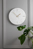 An image showcasing the Moreno Marble White Clock, a timeless and classic addition to any room with its marble construction and minimalist design.