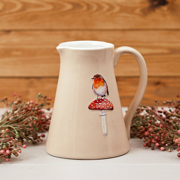 Artfully Crafted Jug Adorned with Robin and Mushroom Motif – A Delightful Blend of Nature and Elegance.