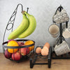 Organize your kitchen with the sleek Apollo Flat Iron Banana Fruit Bowl, designed to hold bananas while offering extra space for other fruits, creating a functional and elegant display.