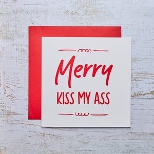 Visualize the Merry Kiss My Christmas Card, featuring a festive design that spreads joy and adds a playful touch to your greetings.