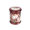 Elegant scented candles in crimson glass jar

