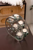 Decorative candles glow in Tree of Life Candle Holder Set

