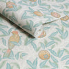 Soft pastel William Morris wallpaper with birds and pomegranates in duck egg tones