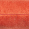 Feather-filled coral scatter cushion for cozy comfort.