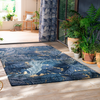 Morris & Co Acanthus Floral Outdoor Rug Indigo lifestyle picture in the patio