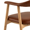 Addi Dining Chair Brandy close view photo of the wooden frame and armrest