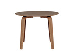Addison round dining table with walnut finish.
