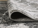 Alisa Abstract Rug Dark Grey & Black: a picture of the bordered end and pile height