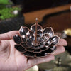 Antique brass candle holders with lotus flower design


