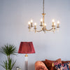 Ambassador 8 Light Armed Pendant Antique Brass life style picture