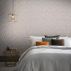 Geometric wallpaper with neutral hues and a luxurious metallic finish.

