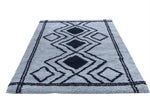Ashton Geometric Rug Blue Navy 03 in a light blue color with avy pattern