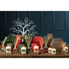 Festive ambiance set with candle and diffuser.