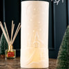 elegant luminaire features a charming church scene