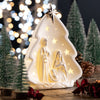 Belleek Living Nativity Tree LED glowing beside a Christmas tree