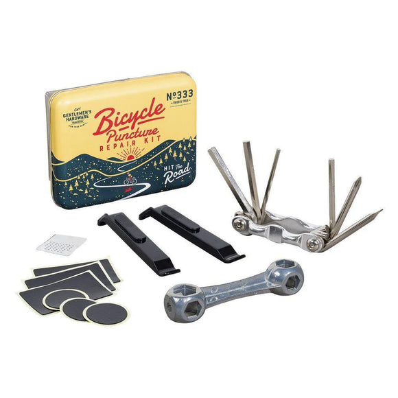 Illustrated tin packaging containing bicycle puncture repair kit.