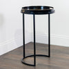 "Circular nest of tables with sleek iron frames"

