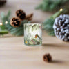 Robin on Christmas Branch candle holder with festive charm.

