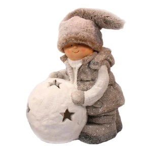 Elevate your holiday decor with the charming Girl figurine in beige, accompanied by an LED snowball. Add a touch of whimsy and festive charm to your space with this delightful holiday decoration.