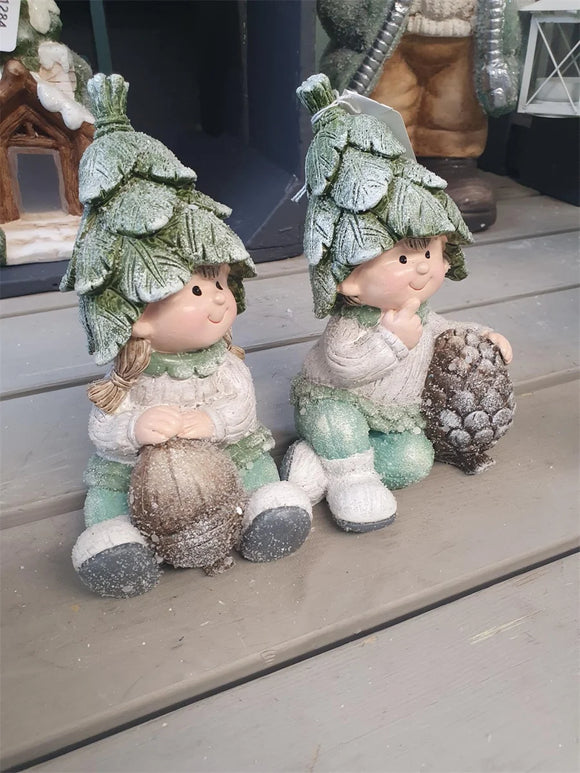 Elevate your holiday decor with the Leaf Kid Decoration. Add a touch of festive charm and whimsy to your space with this delightful and decorative holiday figurine.