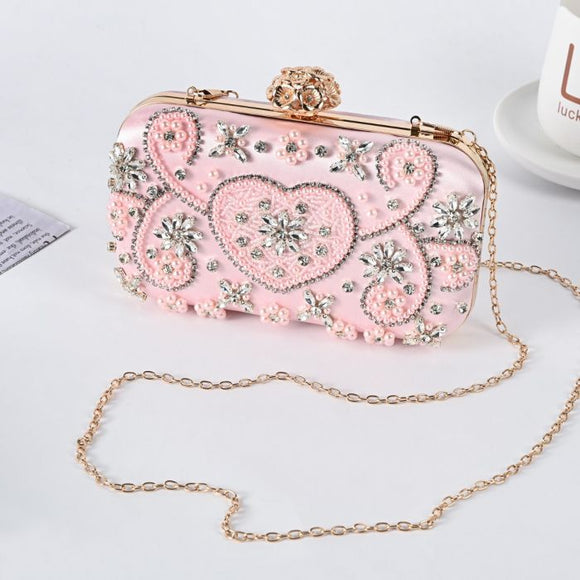 Pink clutch bag embellished with sequins and beads