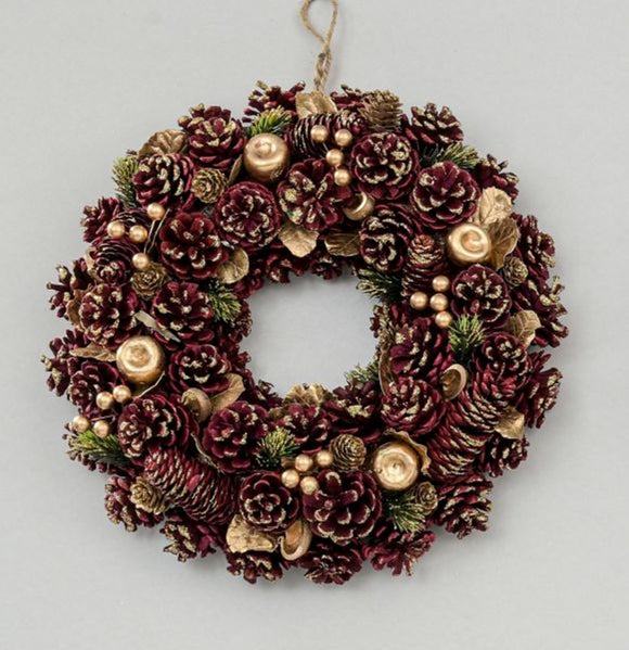 Elevate your holiday decor with the Cone Wreath in Burgundy, measuring 38cm in diameter. Add a touch of elegance and festive spirit to your space with this stylish and welcoming wreath.