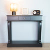 Scroll design console table in black