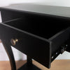 Elegant black console table with drawer