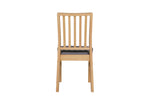 Hevea dining chair with durable lacquer finish.