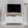White TV stand designed to fit snugly in corners.