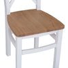 White cross-back chair for stylish dining.