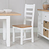 Clean white chair with ladder-back for dining.