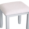 Chic and practical: elevate your vanity with a grey stool.